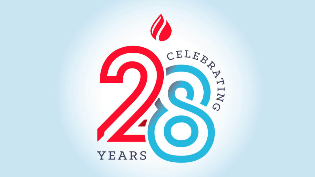 Hot Ink logo celebrating 28 years with vibrant red and blue design.