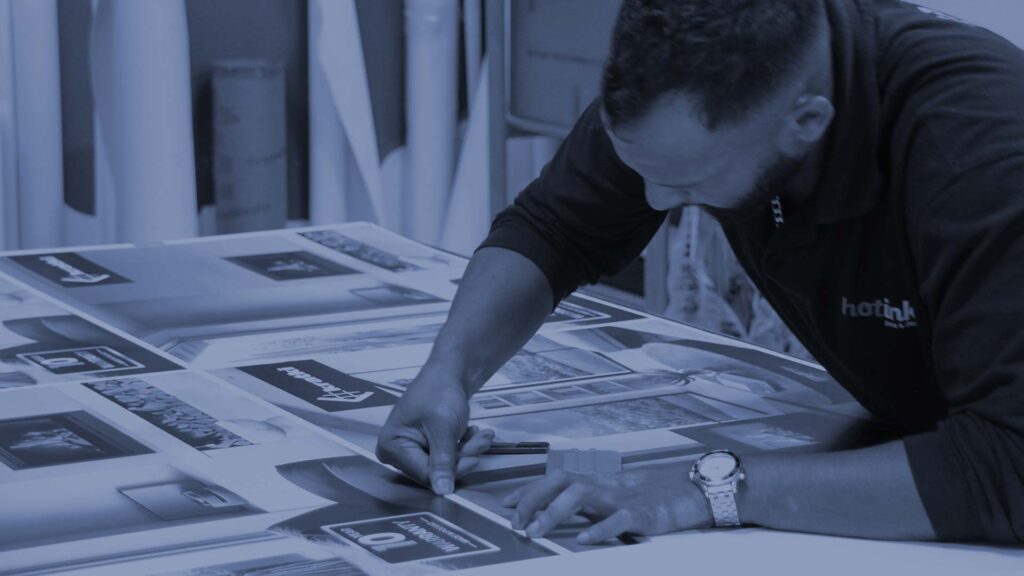 man applying printed vinyl to a surface