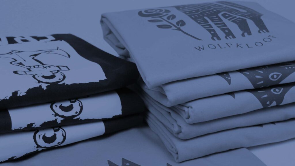 a pile of printed t-shirts