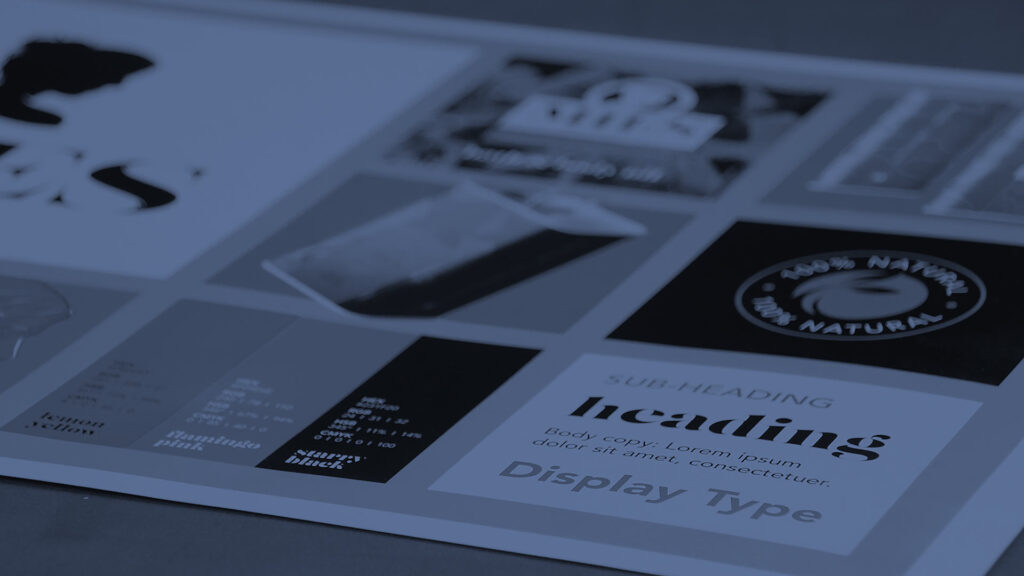 Hot Ink logo and branding on a printed material, showcasing modern typography and design elements.